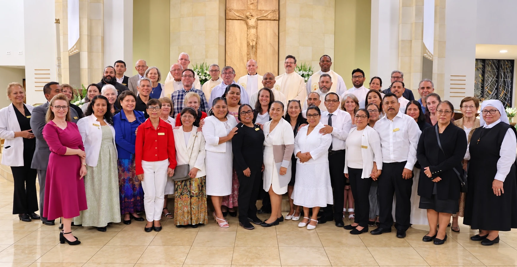 Eudists, religious sisters, and lay associates gathered in a church.